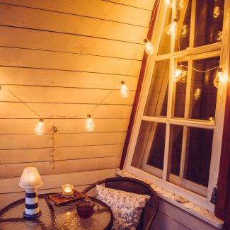 balcony at night with light bulbs.
