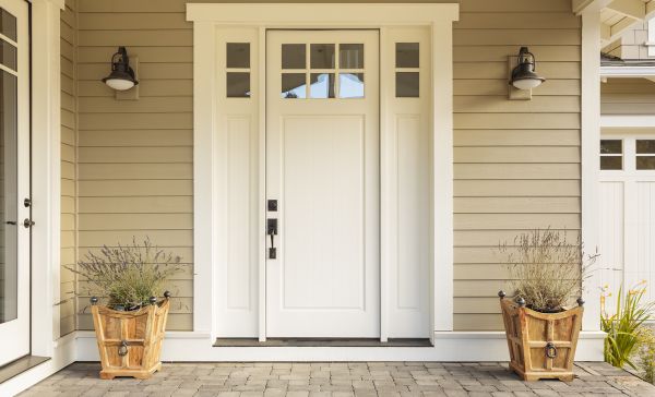 Why do the entry doors to most homes open inward, while in most public buildings, the entry doors open outward?