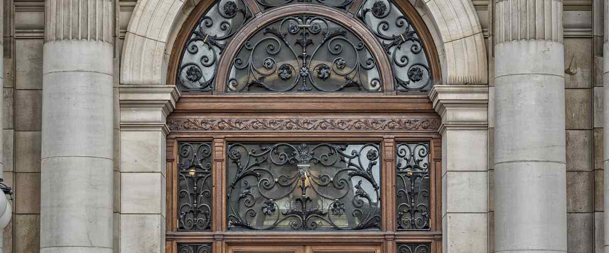 6. Jali Door Design With Intricate Woodwork  