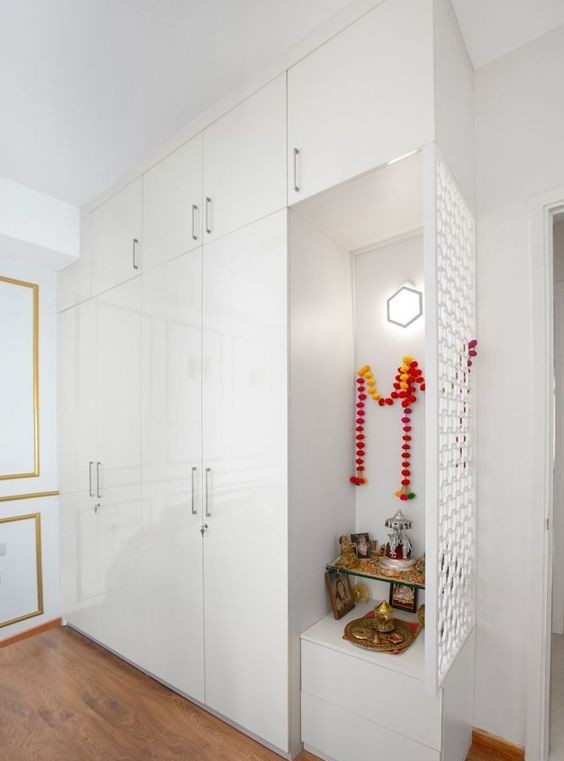 A Pooja Unit Is Included with the All-White Wardrobe.