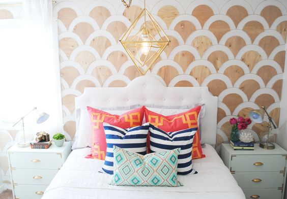 A statement bed headboard design with scalloped wall