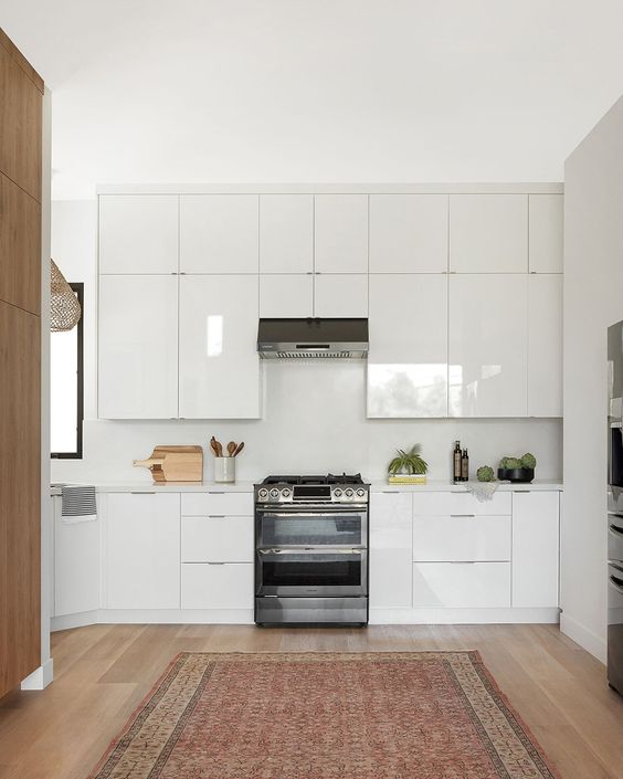 All-White Acrylic Kitchen Cabinet With Brown Pairing