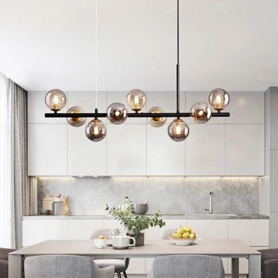 Adding pendant lighting above a u-shaped kitchen design illuminates the entire space perfectly.