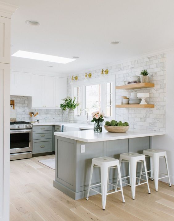 Open shelves are a perfect pairing for the walls that surround a U-shaped kitchen.