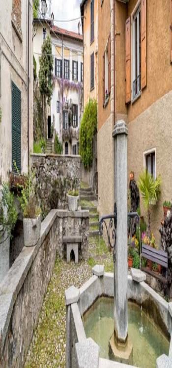 An open courtyard design with a large fountain and open benches.