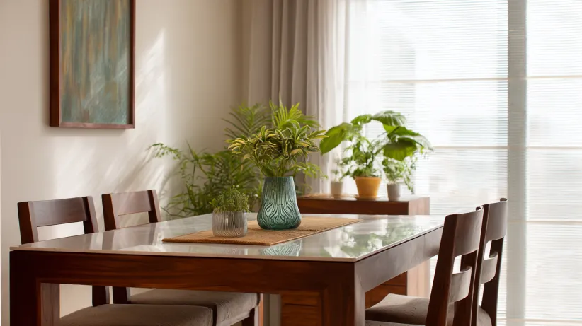 Dark wood table with a white glossy top and matching chairs.