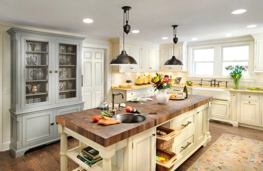 butcher block countertop featured in a warm island kitchen design