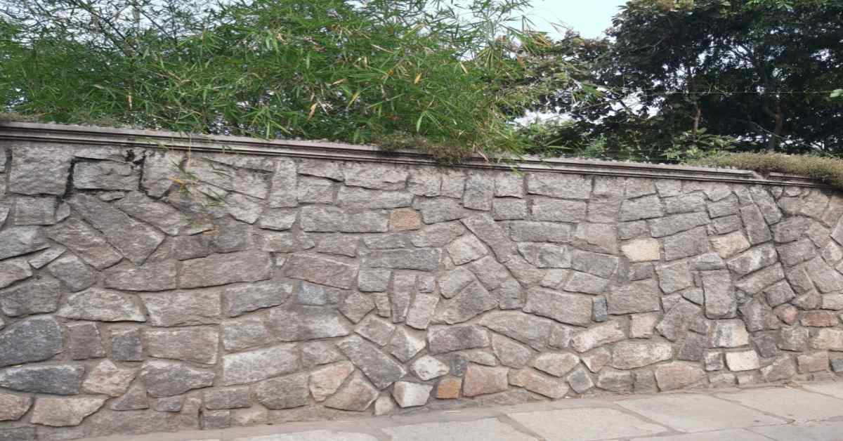 Luxury stone cladding on a high-security compound wall
