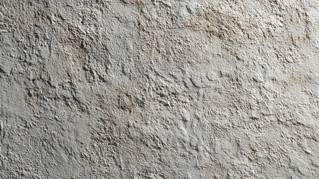 Smooth hand-applied paddle plaster texture on exterior walls