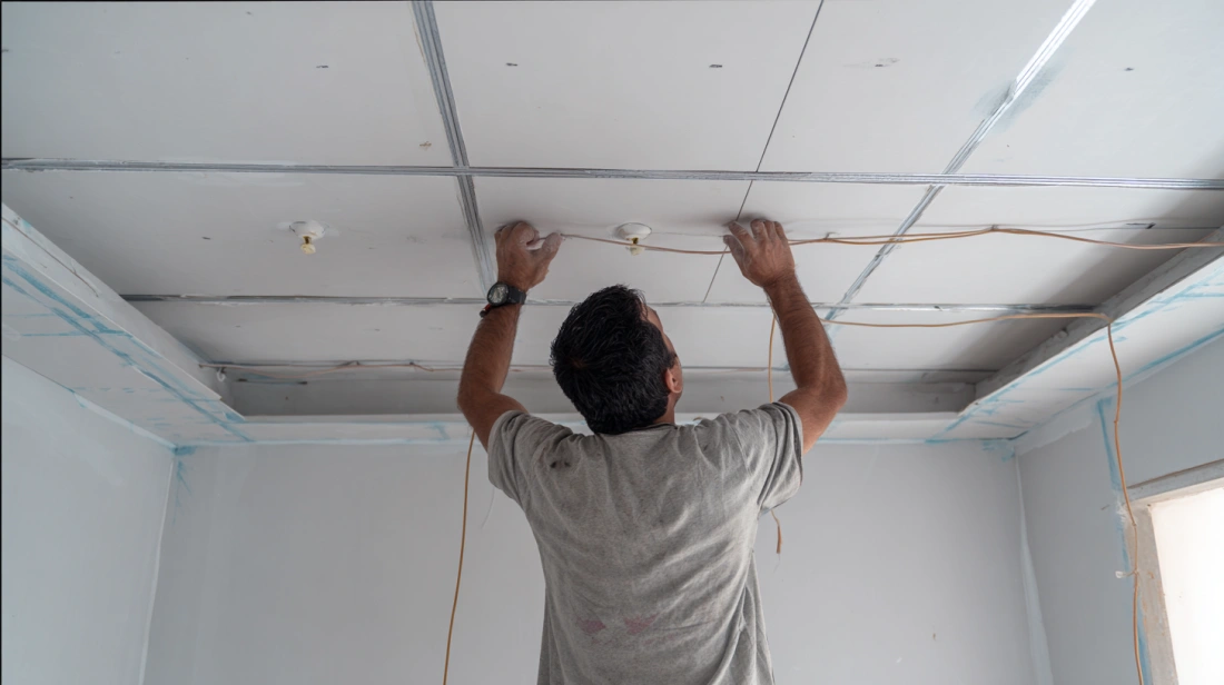 Modern bedroom showcasing a sleek PVC false ceiling
