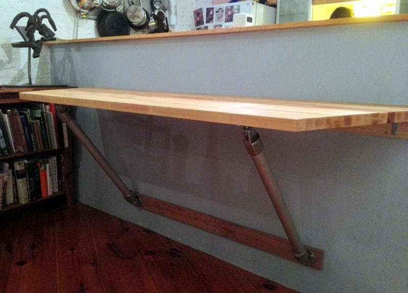 Wall-Mounted Table with a Cooking Station