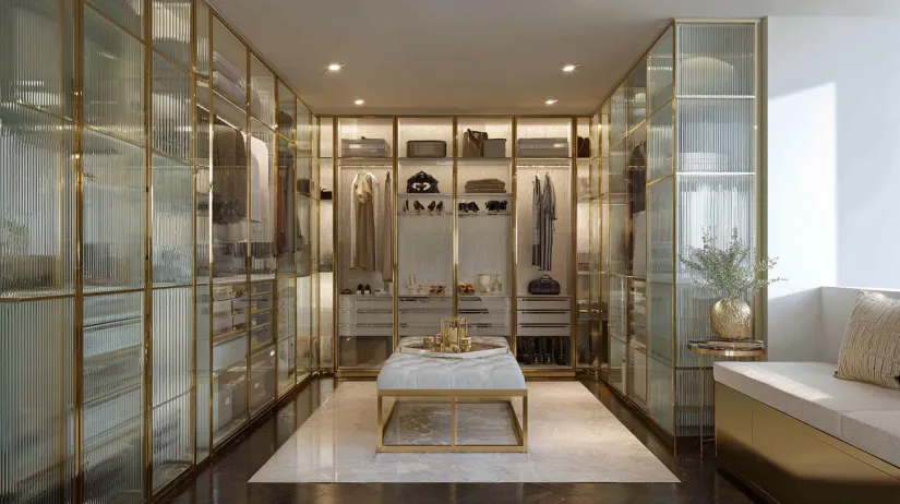 glass wardrobe design with transparent glass doors on spacious walk-in